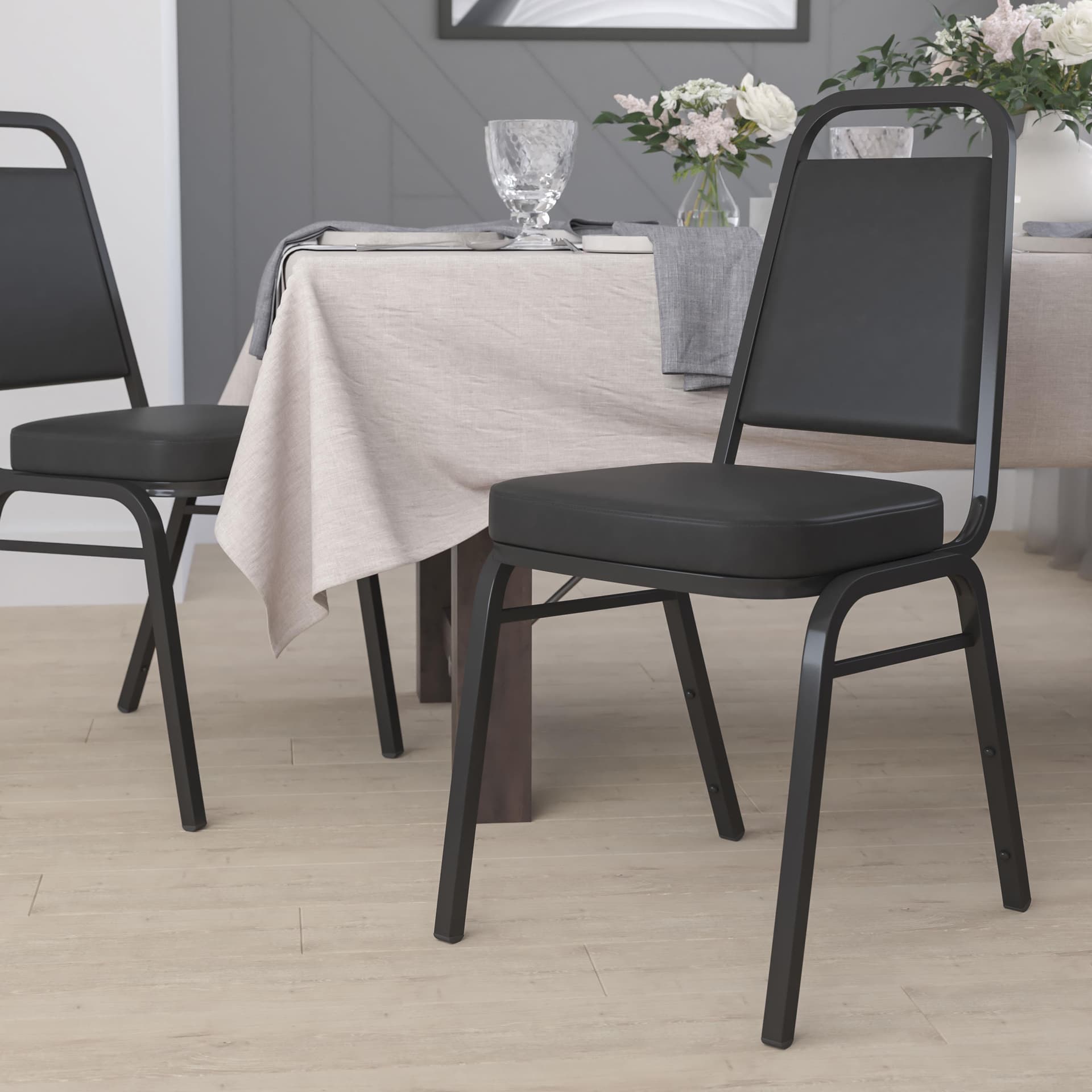 Trapezoidal Back Stacking Banquet Chair in Black Vinyl with 2.5" Thick Seat